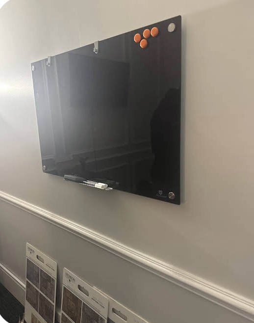 Glass whiteboard mounted in an office by Derjohn