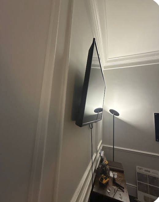 TV mounted on an office wall by Derjohn